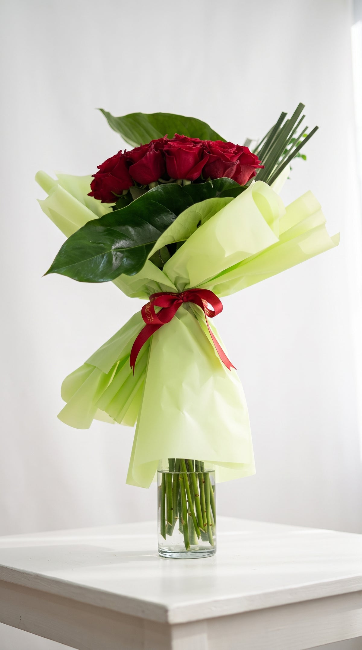 Red Roses Hand Bouquet in Lime Green Wrap