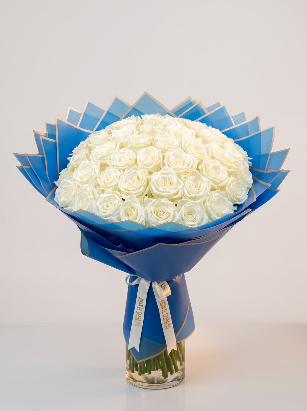 White Roses Bouquet in Royal Blue Wrap