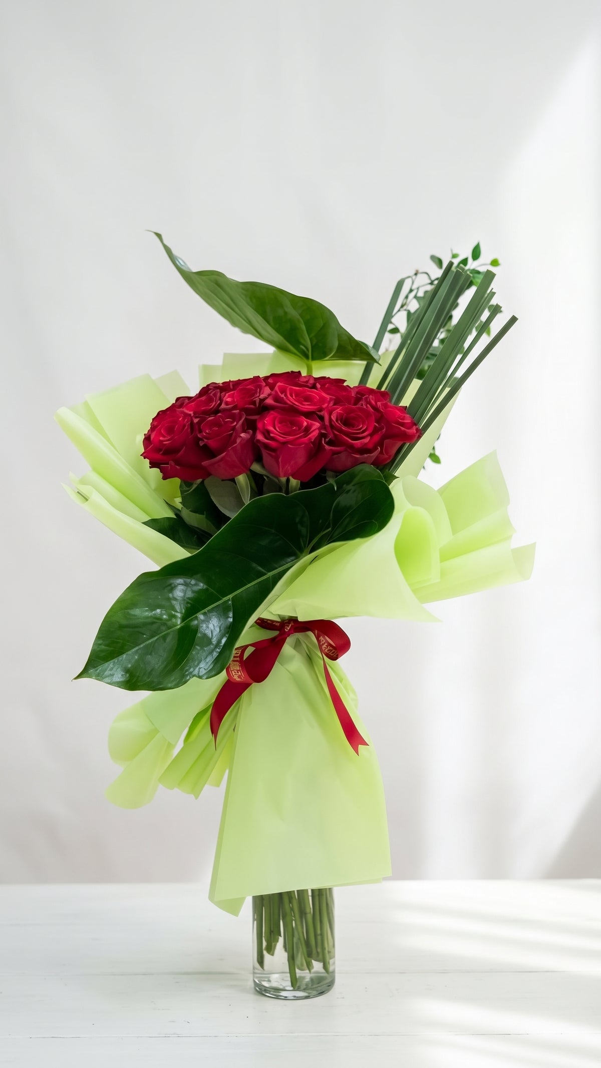 Red Roses Hand Bouquet in Lime Green Wrap